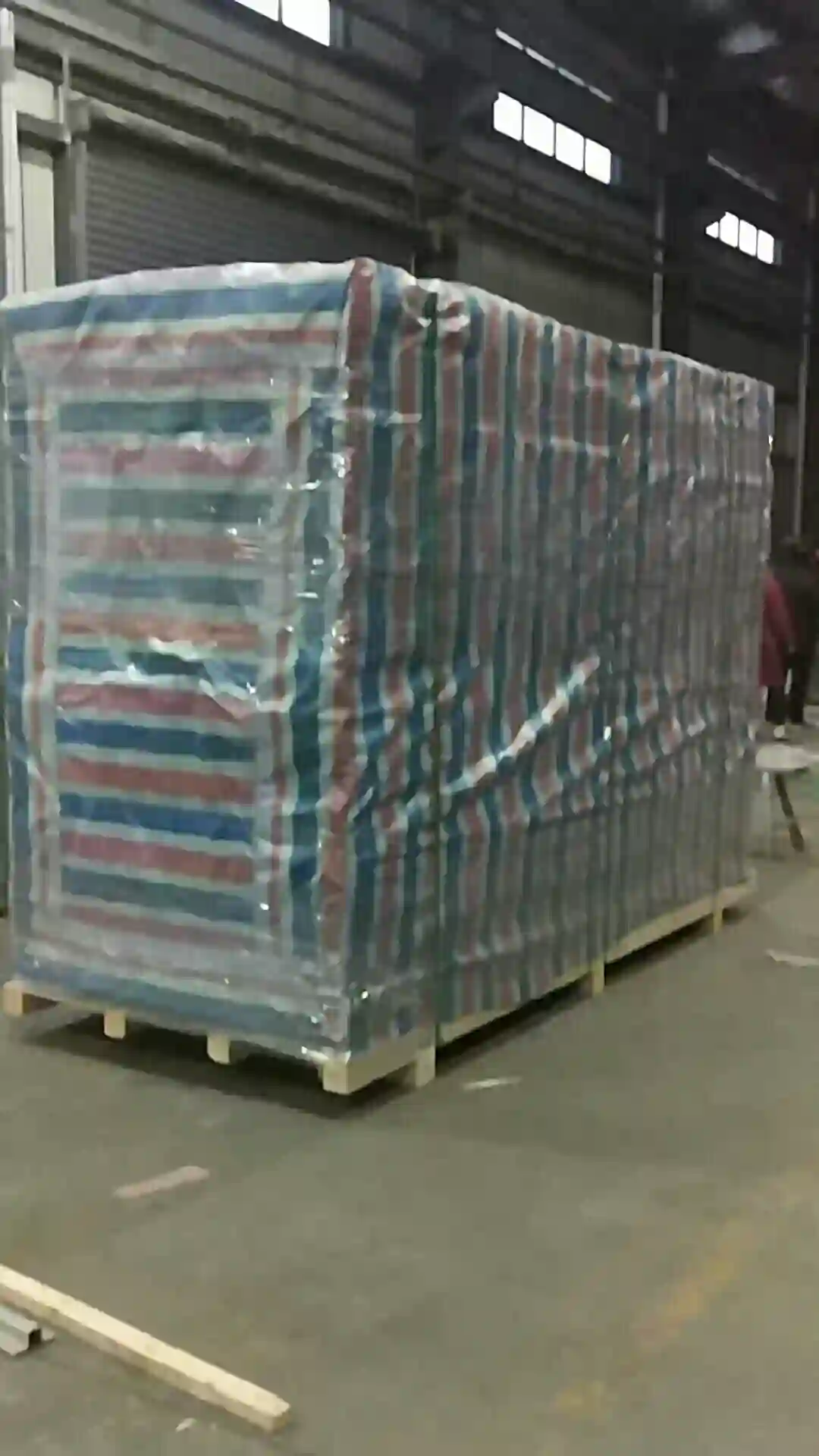 Wrapped export pallets stacked in the factory warehouse before shipping